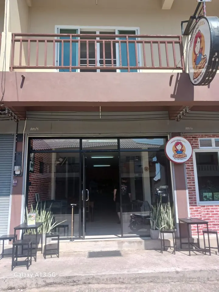 Rose's Roadhouse storefront in Pai with Rose's signs beside and above the entrance
